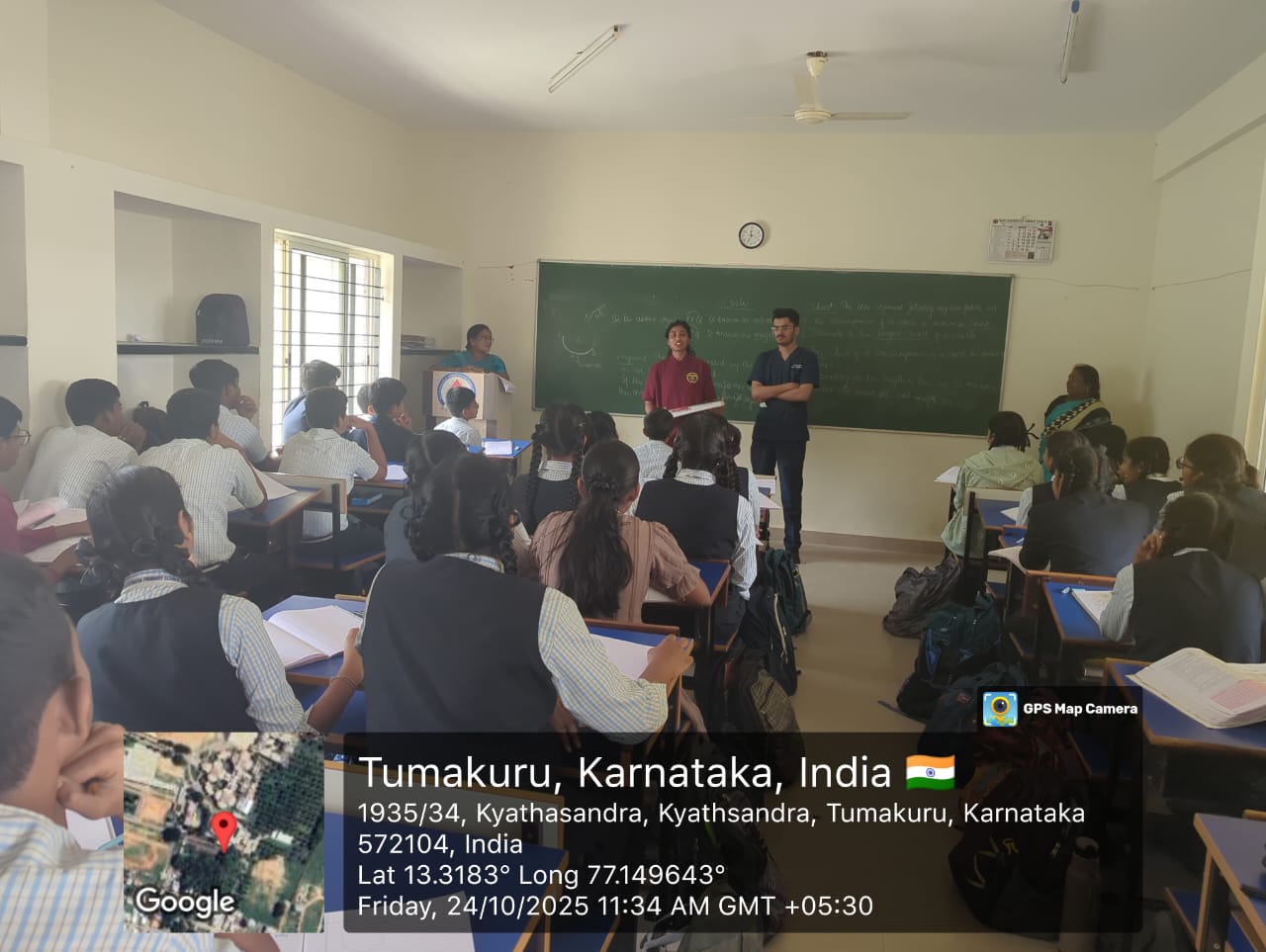 Dentists interacting with students during a health education session on Day 1